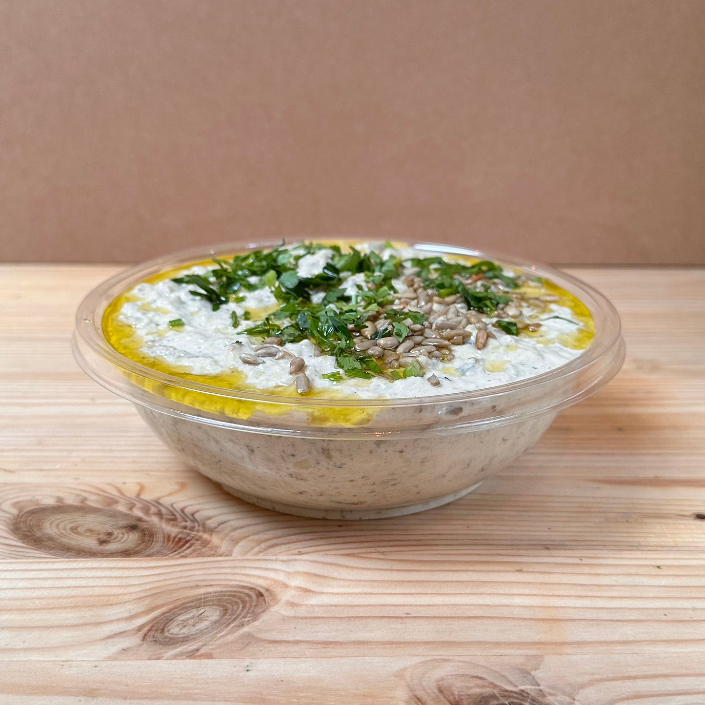 Chargrilled aubergines mixed with tahini and garlic, topped with olive oil and sunflower seeds.