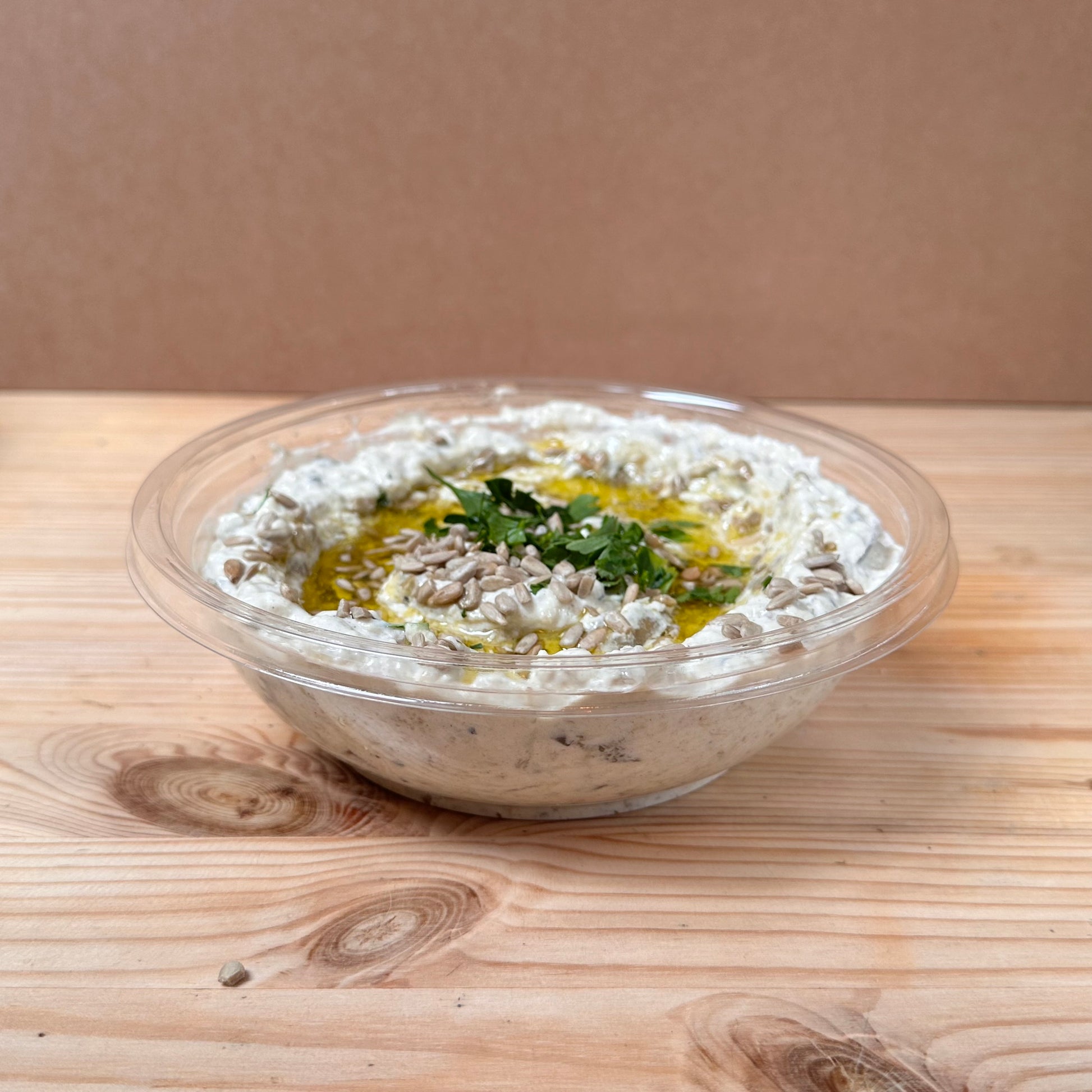Chargrilled aubergines mixed with mayonnaise and garlic, topped with olive oil and sunflower seeds. 