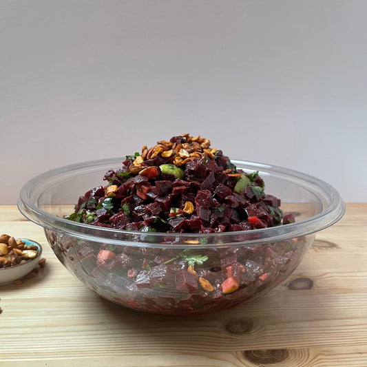Vibrant Beetroot Salad with cooked beetroot, crisp green apple, fresh coriander, and spiced cashew nuts, all tossed in a zesty olive oil and lemon dressing